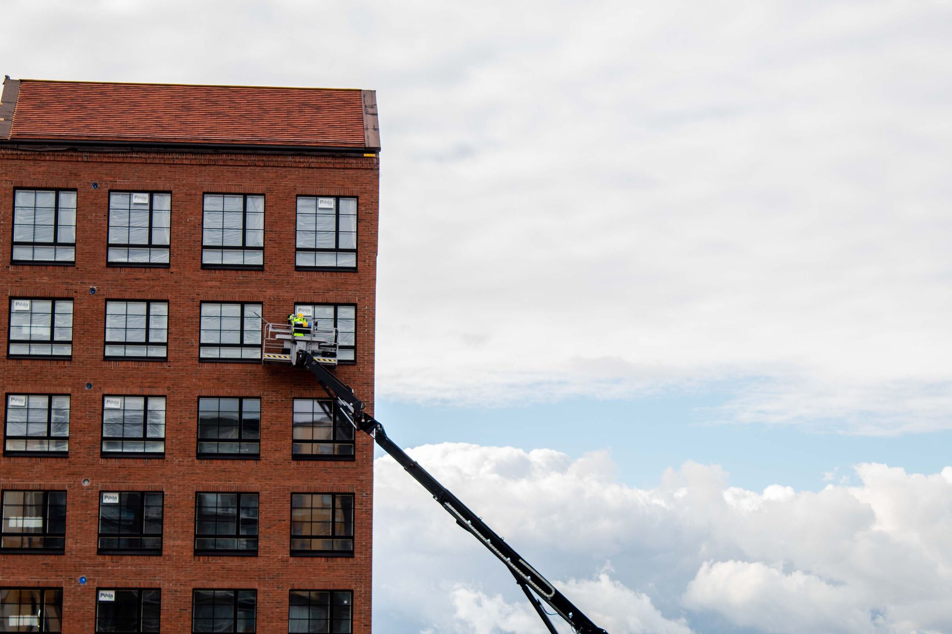 Maintenance worker inspecting building